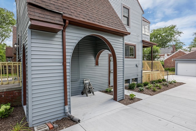 view of home's exterior featuring an outbuilding