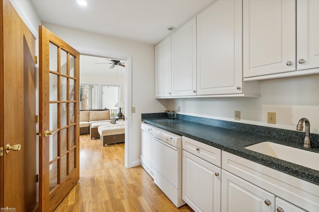 kitchen with sink, ceiling fan, white dishwasher, white cabinets, and light wood-type flooring