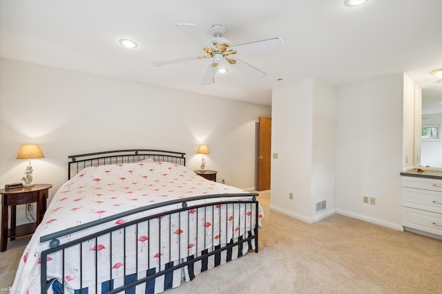 bedroom featuring light colored carpet and ceiling fan