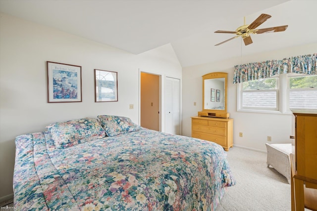 carpeted bedroom featuring vaulted ceiling and ceiling fan