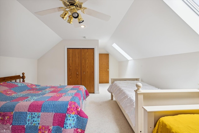 bedroom with light colored carpet, ceiling fan, vaulted ceiling, and a closet