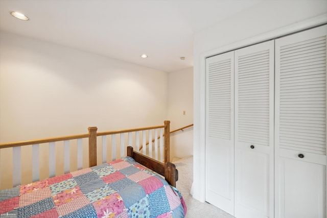 bedroom with a closet and carpet flooring