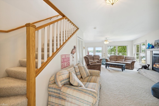 living room featuring carpet and ceiling fan