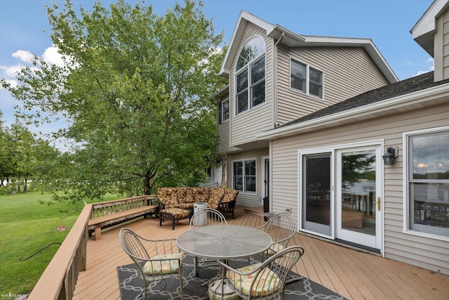 wooden deck with a lawn