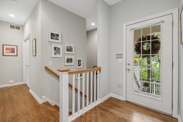 doorway to outside featuring hardwood / wood-style floors and a wealth of natural light