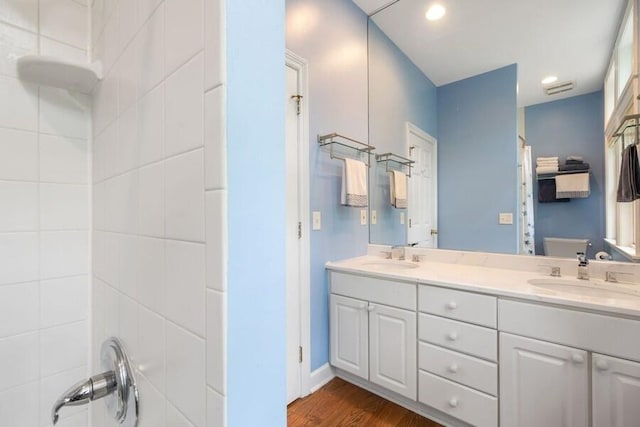 bathroom featuring hardwood / wood-style floors, vanity, and toilet