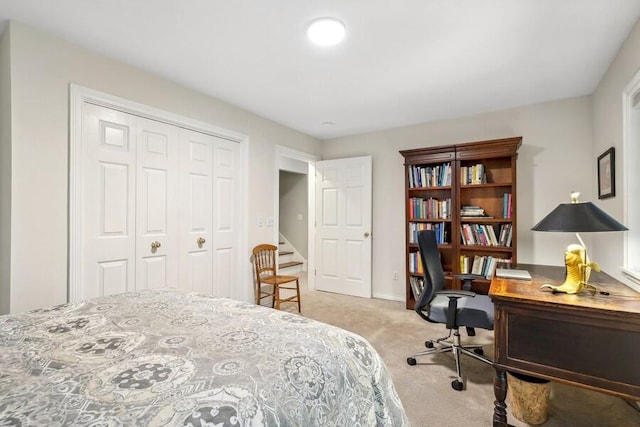 carpeted bedroom featuring a closet