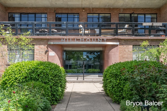 entrance to property with a balcony