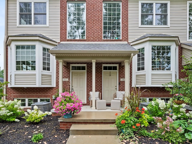 doorway to property featuring covered porch