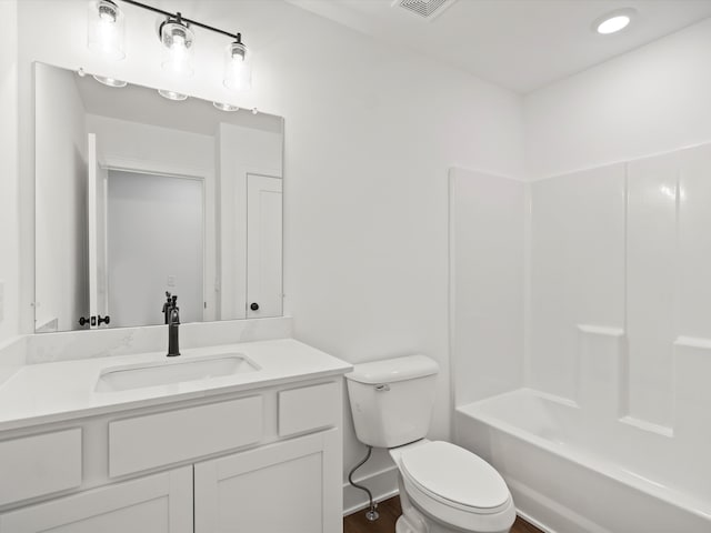 full bathroom featuring shower / bathtub combination, hardwood / wood-style flooring, toilet, and vanity