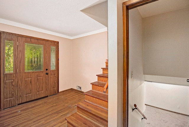 entryway with wood-type flooring