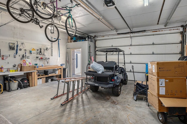 garage featuring a workshop area and a garage door opener