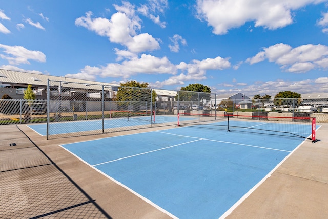 view of tennis court featuring basketball court