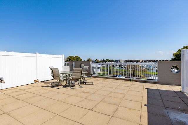 view of patio with a water view