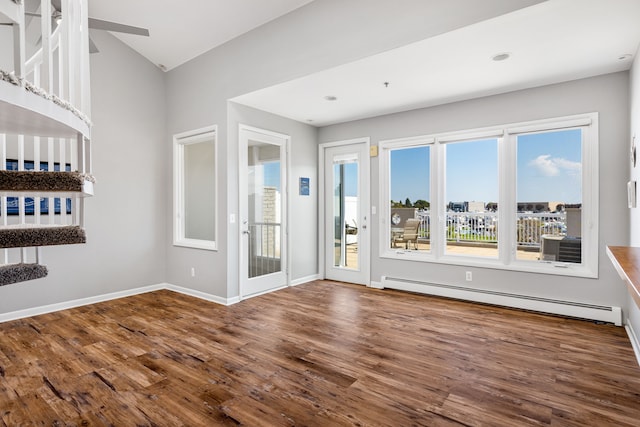 interior space featuring hardwood / wood-style flooring and a baseboard heating unit