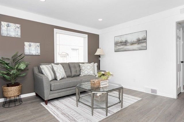 8410 Grandville Ave, Detroit, MI 48228 - living room featuring wood finished floors, baseboards, and recessed lighting