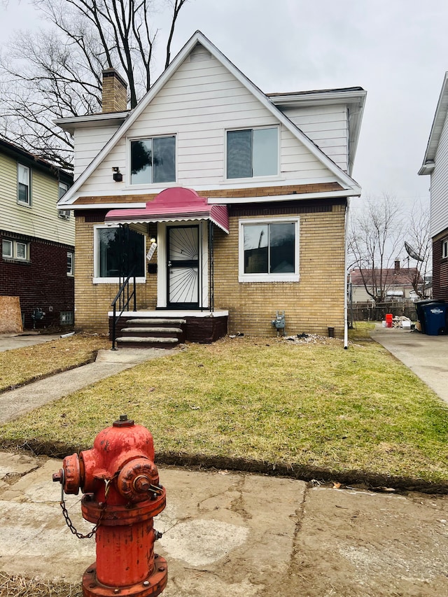 front facade featuring a front lawn