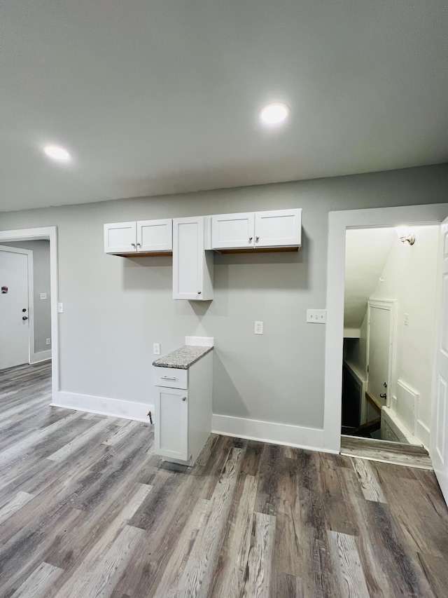 laundry room with hardwood / wood-style floors