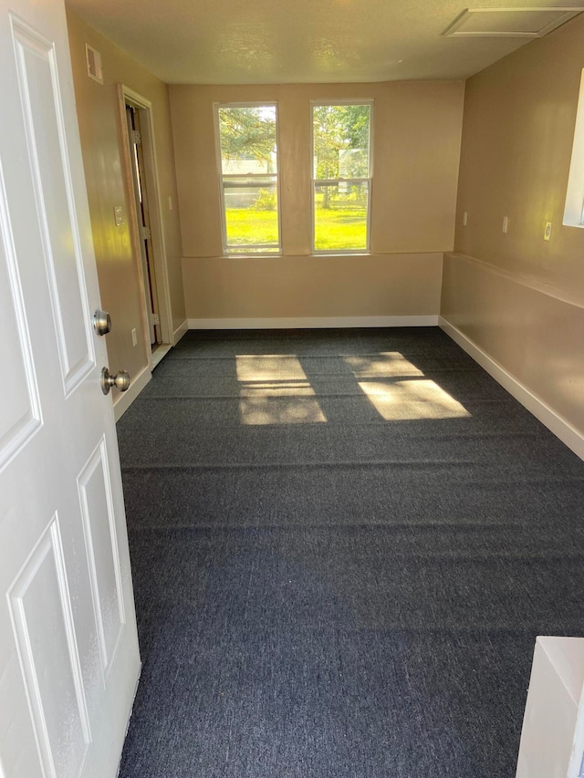 spare room with visible vents and baseboards