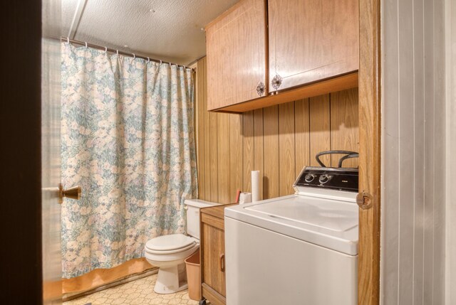11451 Hemlock Ave, Lake, MI 48632 - laundry area with washer / clothes dryer, wooden walls, a textured ceiling, and light flooring