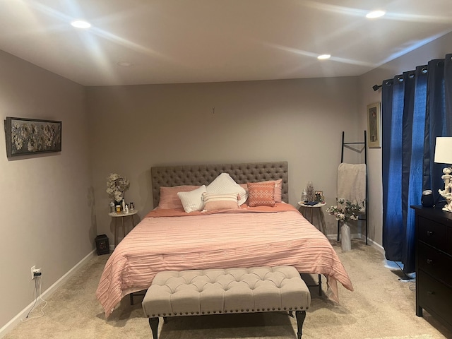 bedroom featuring light carpet