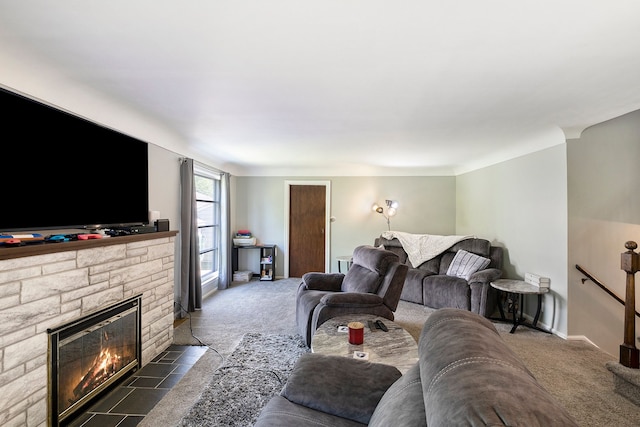 living room with a fireplace and dark carpet