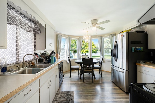 kitchen with stainless steel fridge, dark hardwood / wood-style flooring, ceiling fan, sink, and white cabinets