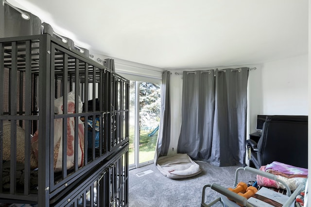 living area featuring carpet floors and visible vents
