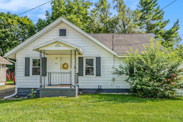 bungalow-style house with a front lawn