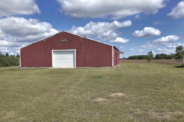 20682 Honor Hwy, Interlochen, MI 49643 - view of pole building featuring a yard
