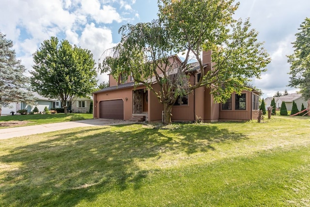 view of front facade with a garage and a front lawn