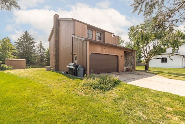 view of front of property with a garage and a front lawn