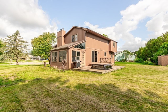 rear view of house featuring a patio area and a yard