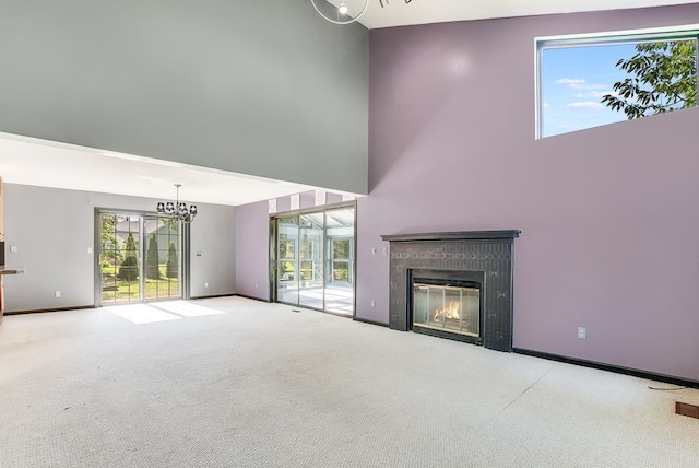 unfurnished living room featuring plenty of natural light and light colored carpet