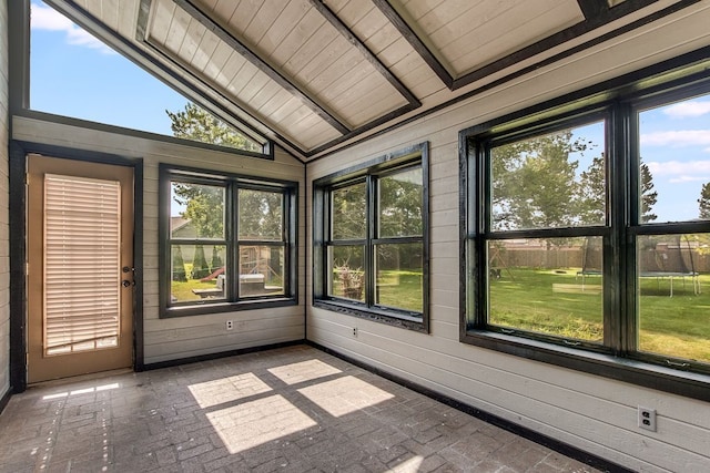 unfurnished sunroom featuring plenty of natural light, lofted ceiling, and wood ceiling