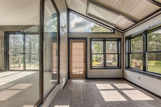 unfurnished sunroom with wooden ceiling, a wealth of natural light, and lofted ceiling