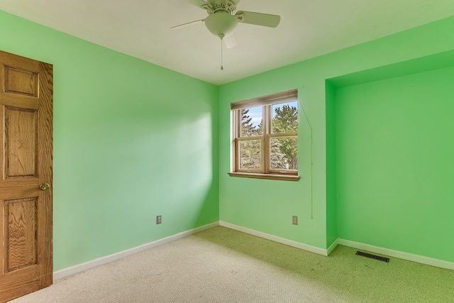 empty room featuring carpet and ceiling fan