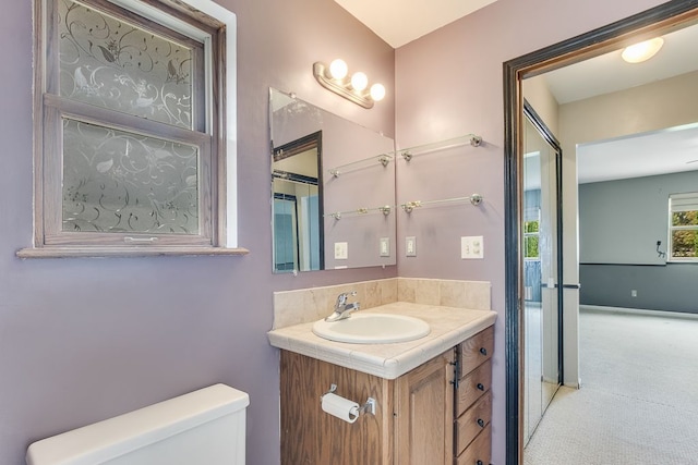 bathroom featuring vanity and toilet