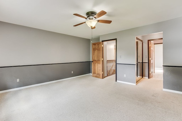 unfurnished bedroom featuring ceiling fan and light colored carpet