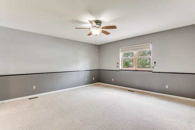 carpeted empty room featuring ceiling fan