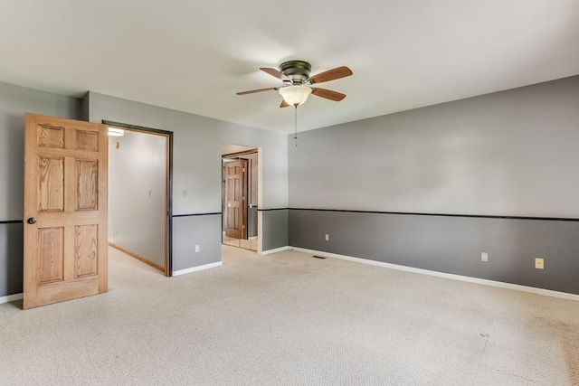 unfurnished room with light carpet and ceiling fan