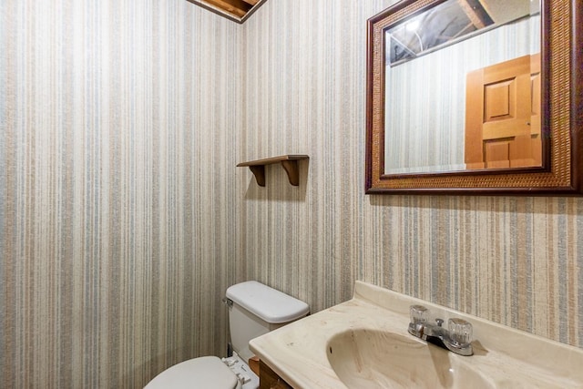 bathroom featuring toilet and sink