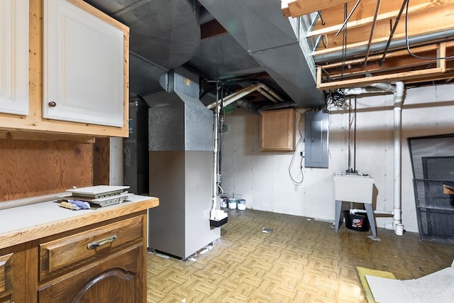 basement with electric panel, heating unit, and light parquet flooring