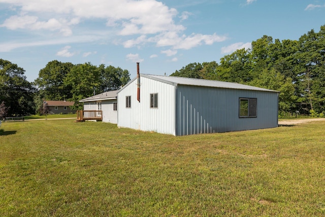 view of side of home featuring a lawn