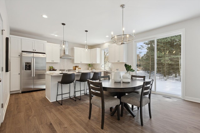 dining area with a chandelier, recessed lighting, visible vents, and dark wood finished floors