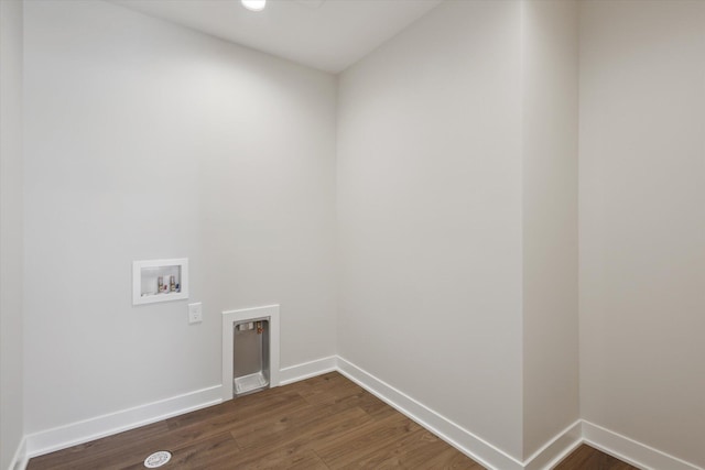 laundry room with dark wood-style floors, laundry area, washer hookup, and baseboards