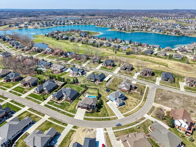 birds eye view of property with a residential view and a water view