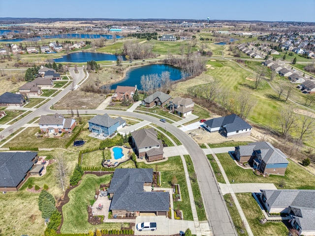 bird's eye view with a residential view, a water view, and view of golf course