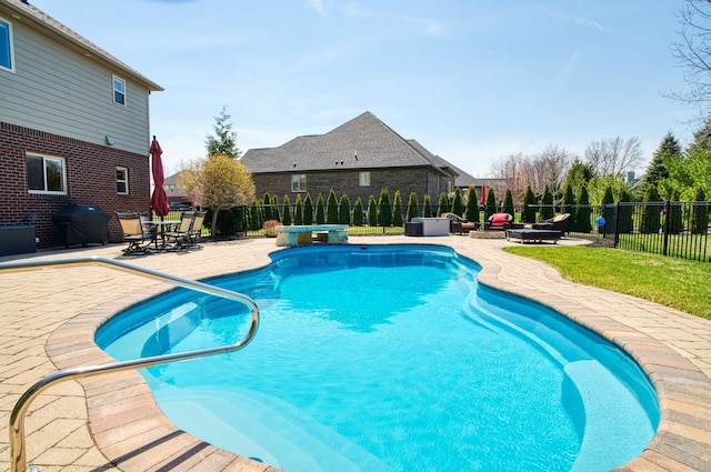 view of pool featuring a fenced backyard, a fenced in pool, a grill, and a patio