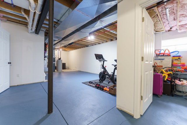 unfinished below grade area featuring gas water heater
